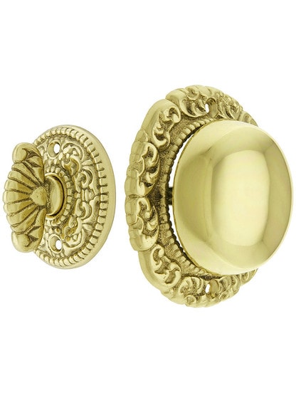 Small Scroll Design Twist Door Bell in Polished Brass.